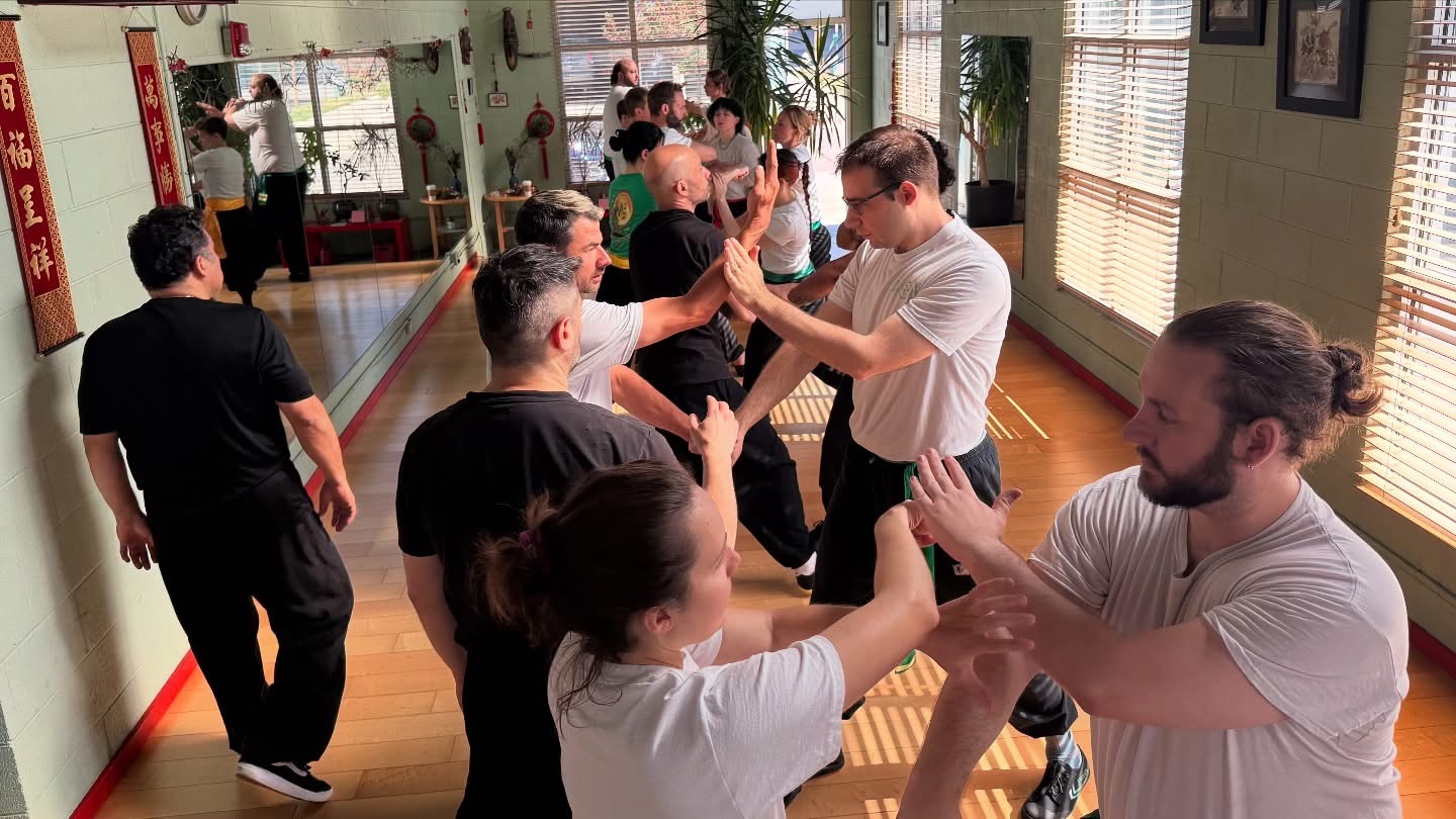 Boulder Kung Fu Academy students practicing two-person exercises