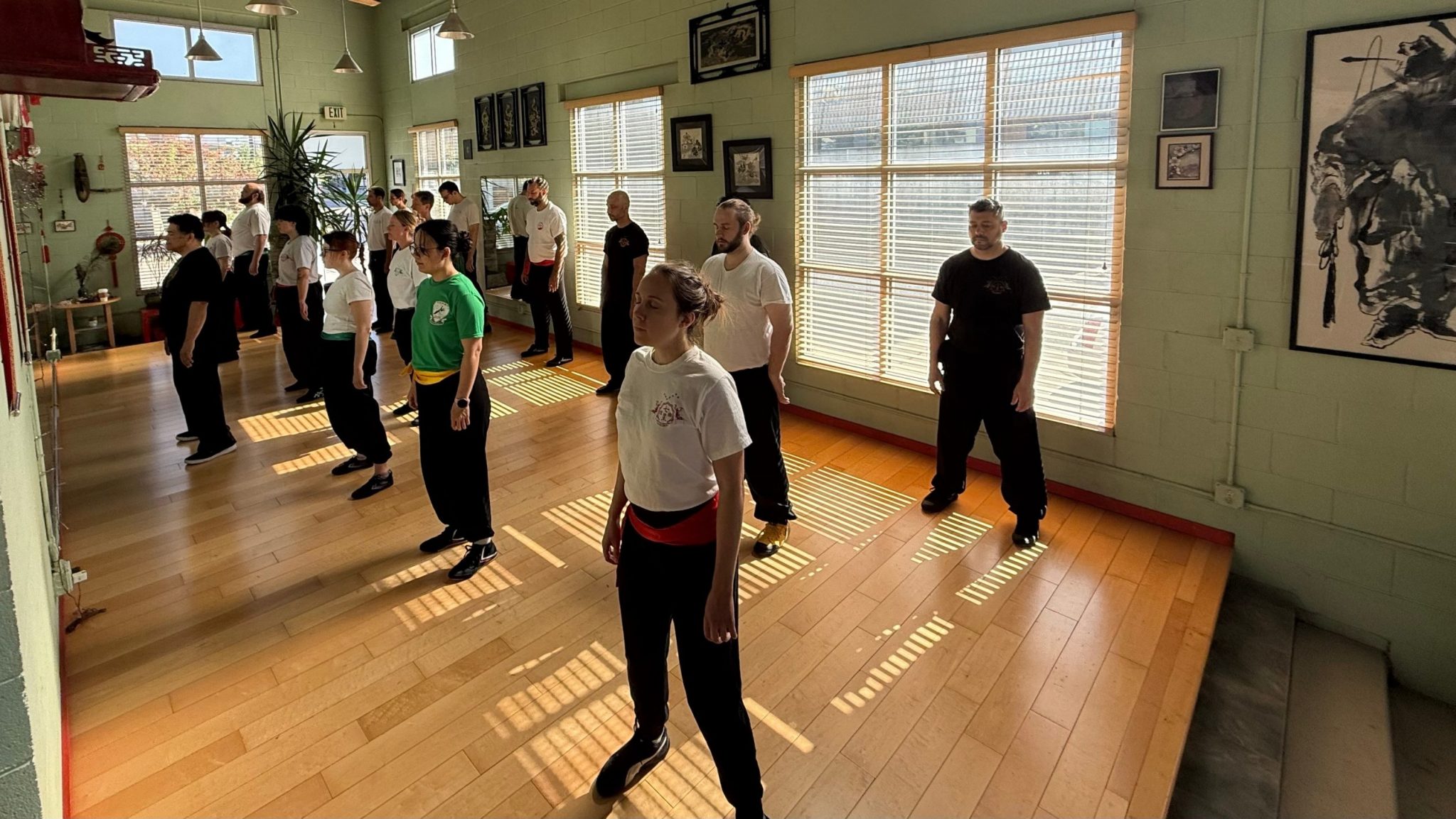 Boulder Kung Fu Academy students practicing Qigong in the studio